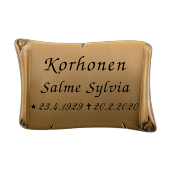 Pronssinen muistolaatta hautakiveen